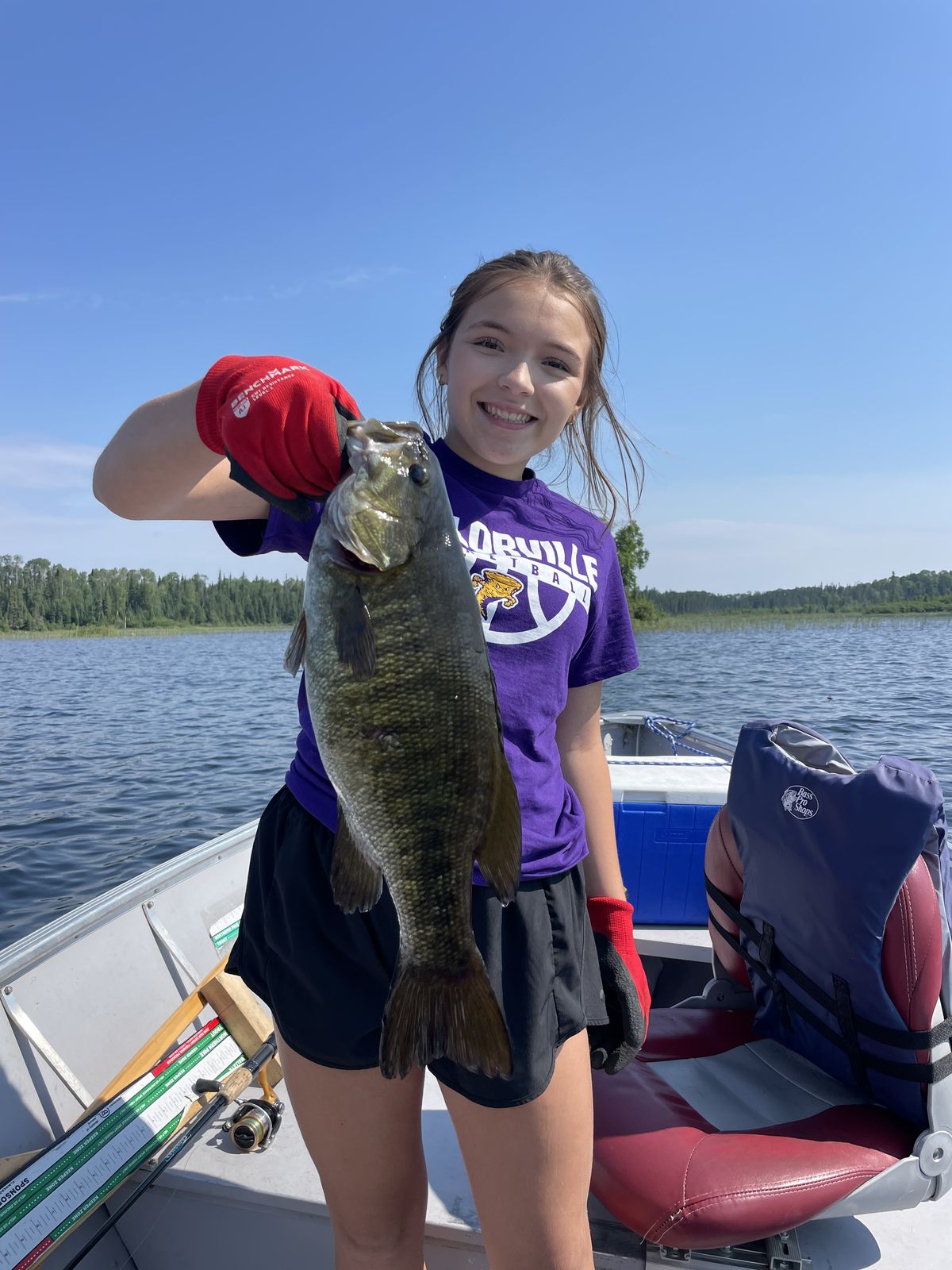 Young angler with a smallmouth bass