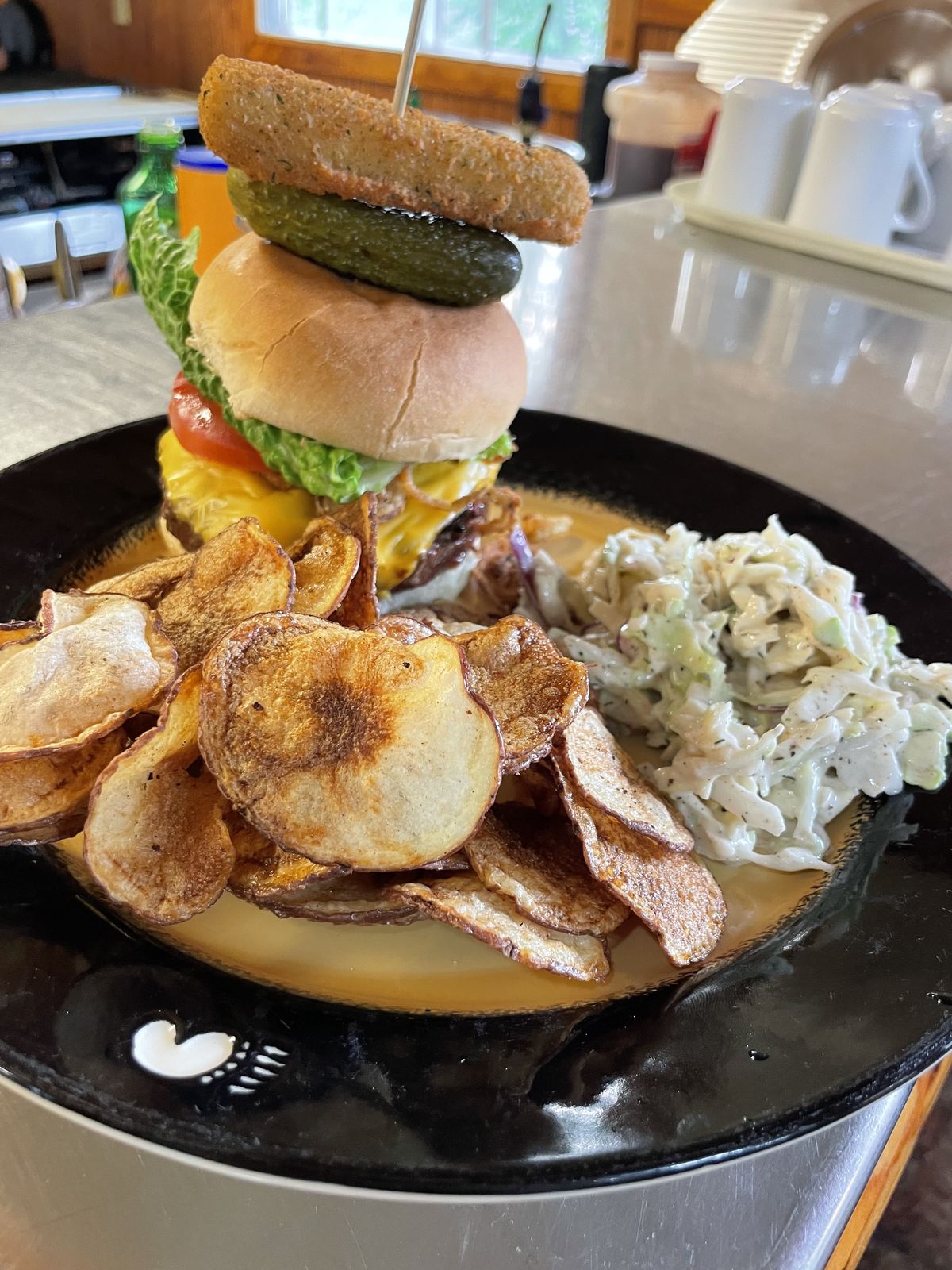 Lodge-made cheeseburger with kettle chips and slaw